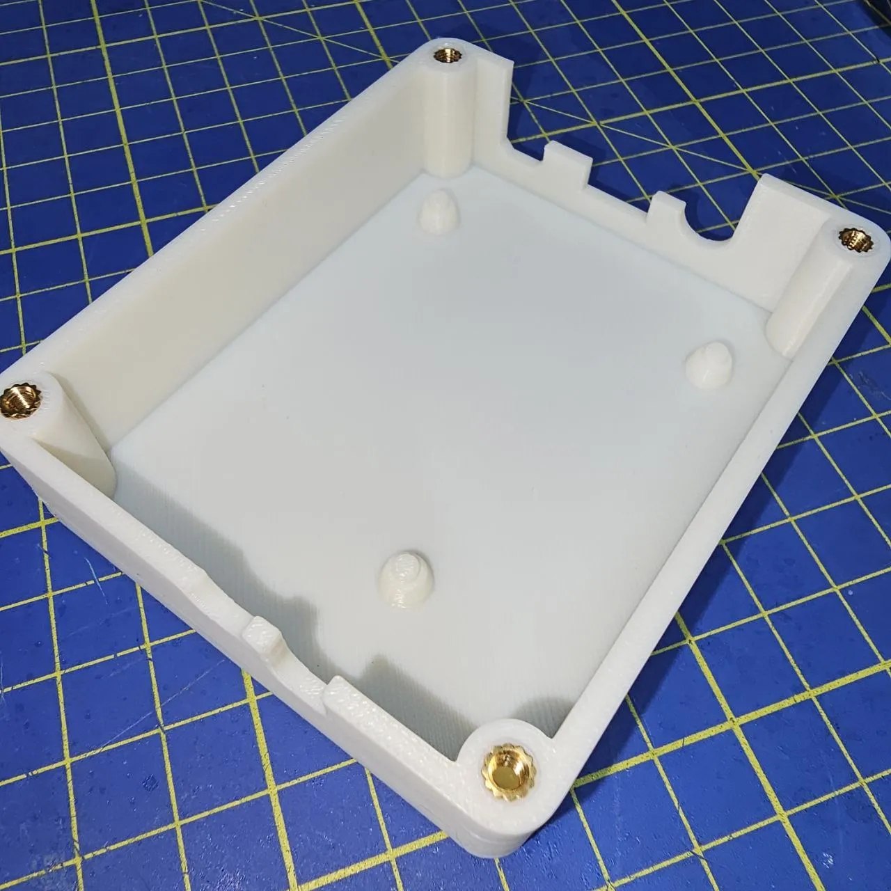 Brass inserts pushed into the cover